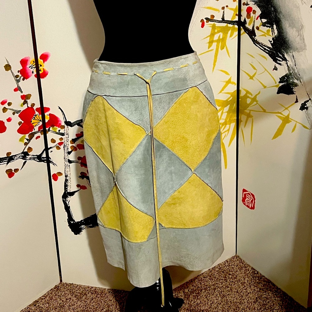Suede skirt; size 10, back zipper, fully lined, string belt attached.